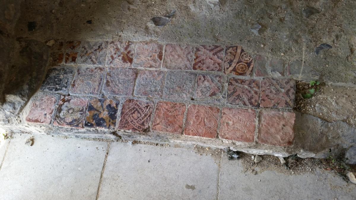 Decorative floor tiles re-laid from elsewhere in the church, now in the Chapel of St Mary and the Angels